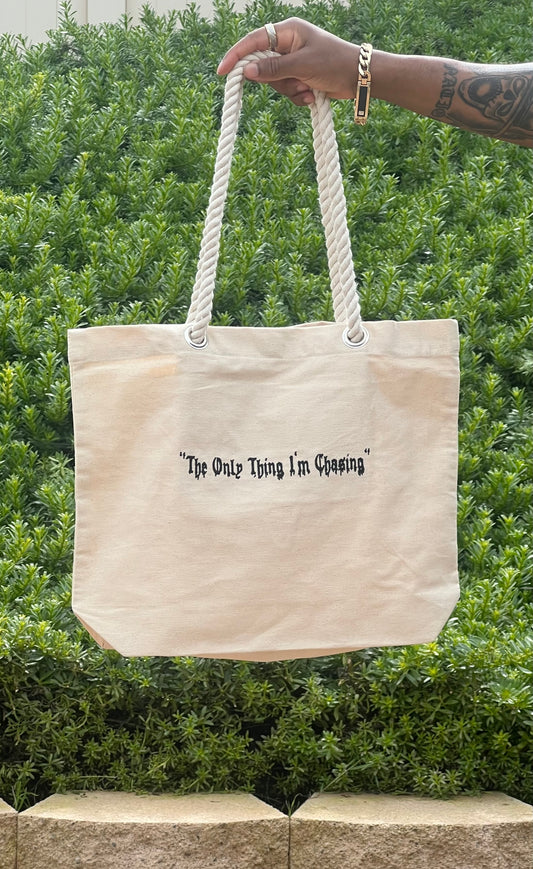 "The Only Thing I'm Chasing" tote bag